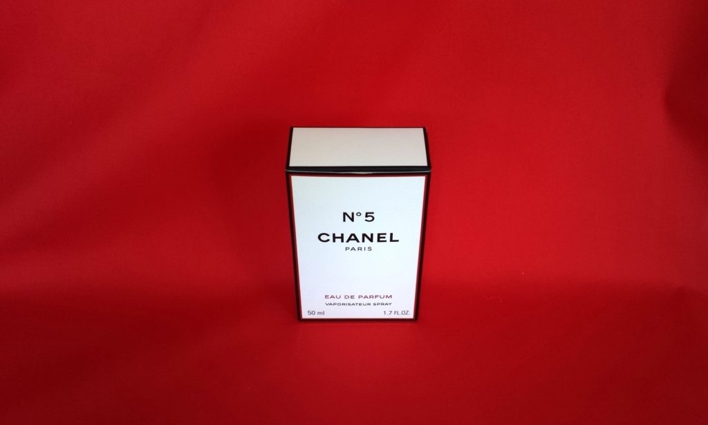 fragrance Chanel 5 on a red background
